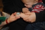 Option for young children.  Paint on their hand instead of their face.